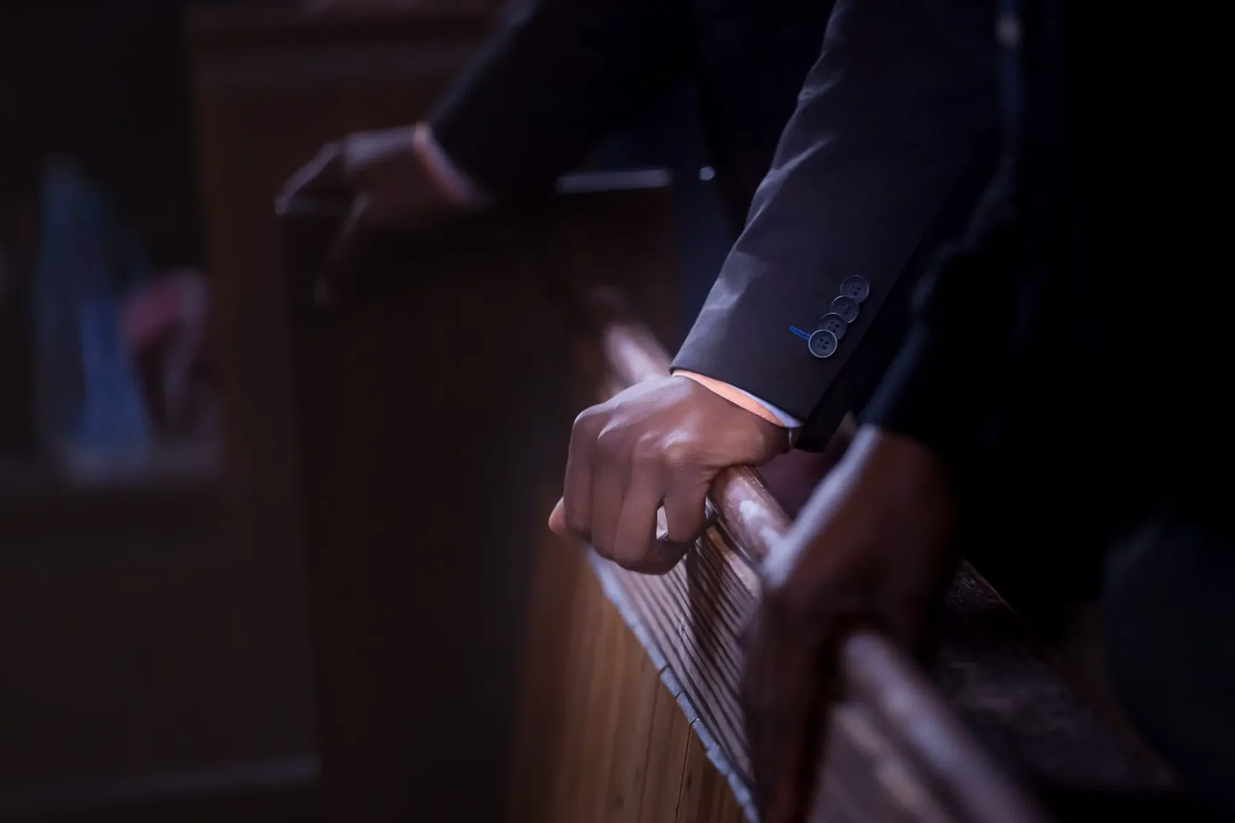 A worshipper resting their hands during a church service